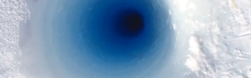 still from a video shows of core or hole in a glacier