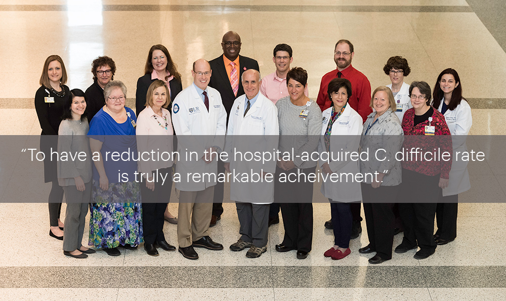 group portrait with the quote, "to have a reduction in the hospital-acquired C. difficile rate is truly a remarkable achievement.”