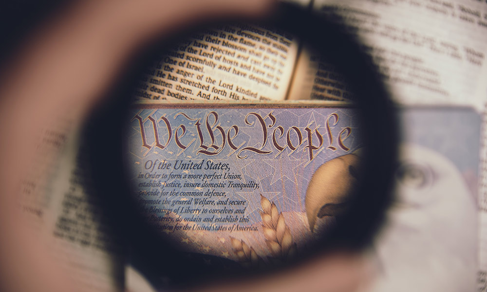 phrase we the people under a magnifying glass