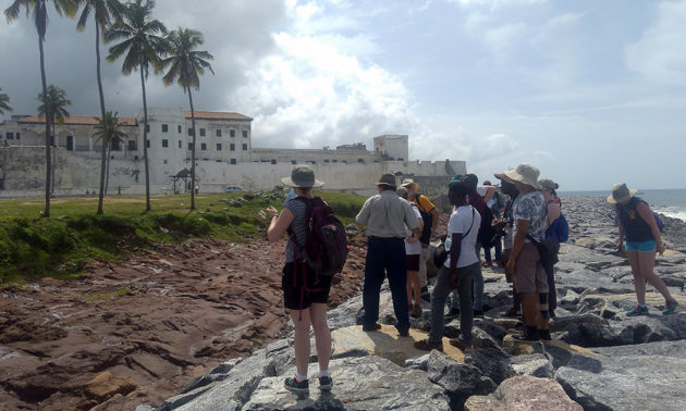 group of students outside a castle