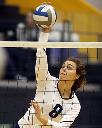 female volleyball player at the net