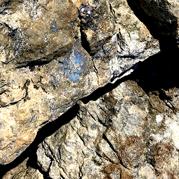 close-up of rocks with sparking blue crystals
