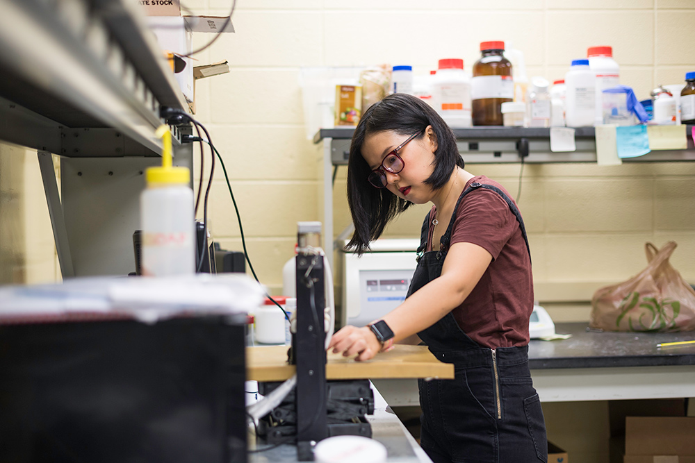 portrait of April Wang working in a lab