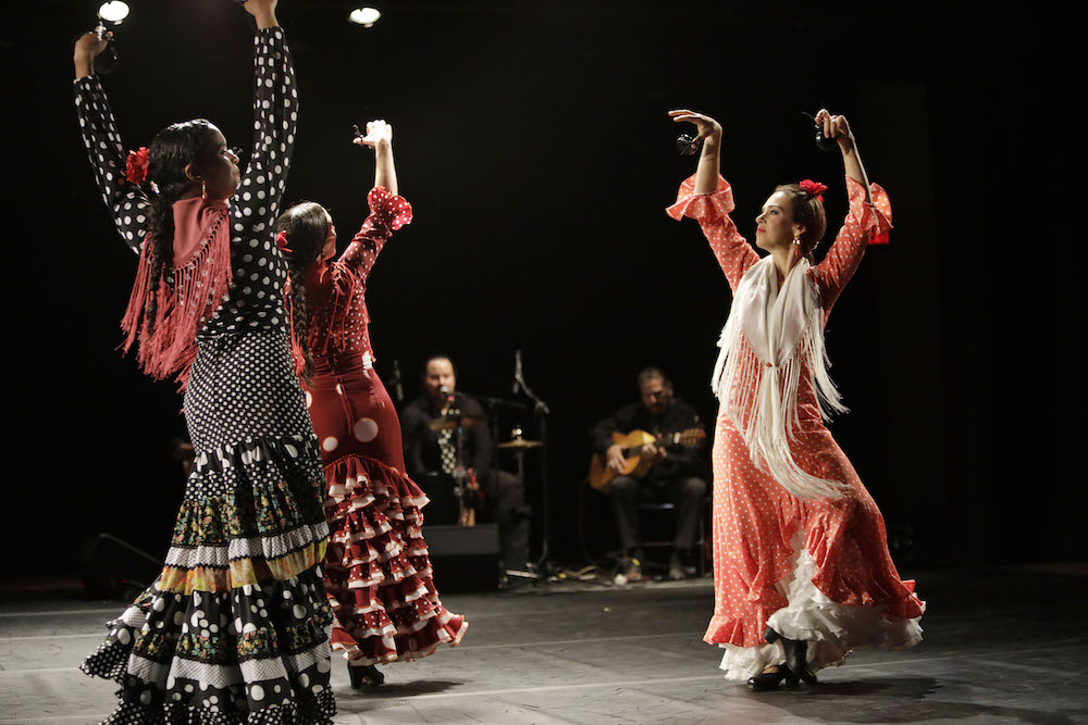 three women flamenco dancing
