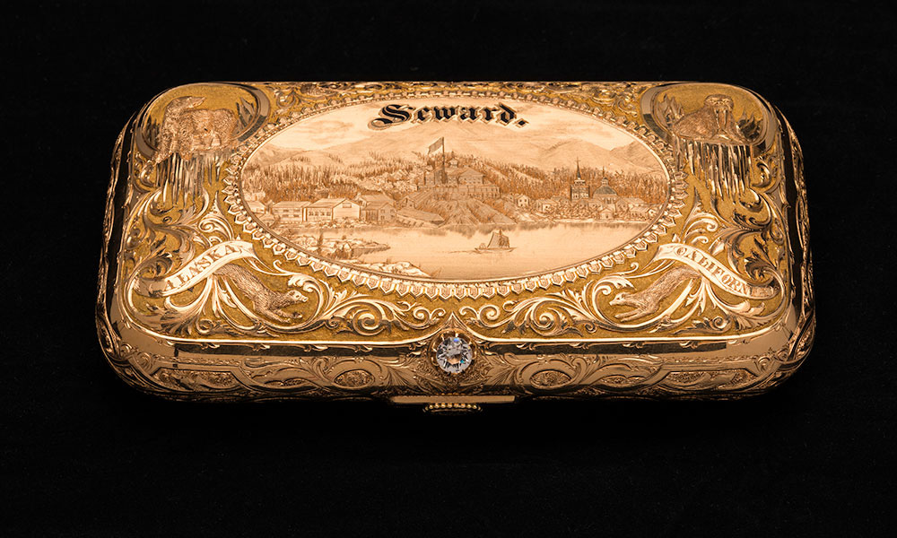 gold snuff box with SEWARD engraved on it