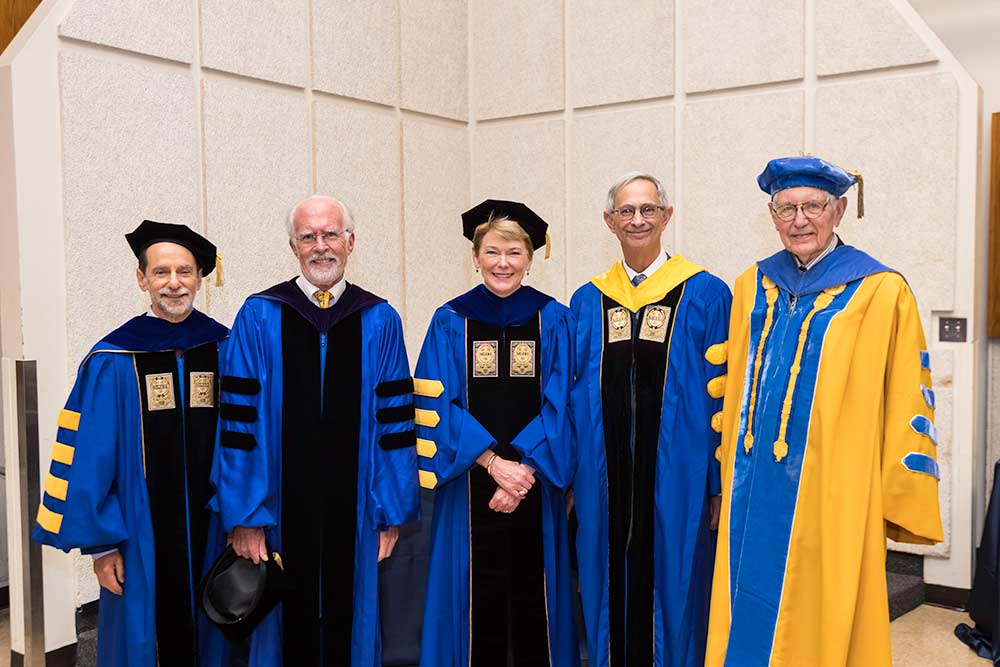 portrait of five presidents in academic robes