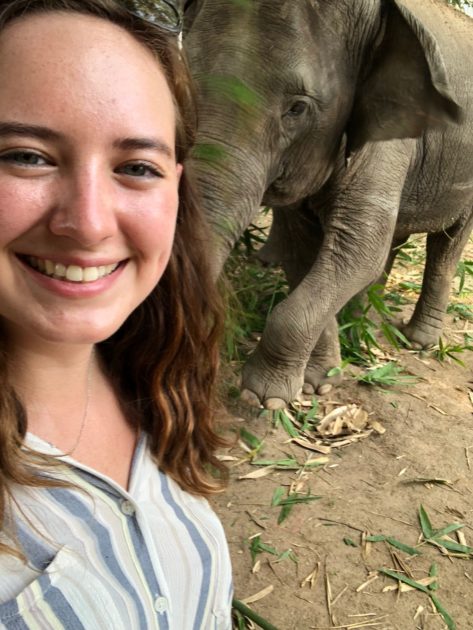 student selfie with elephant