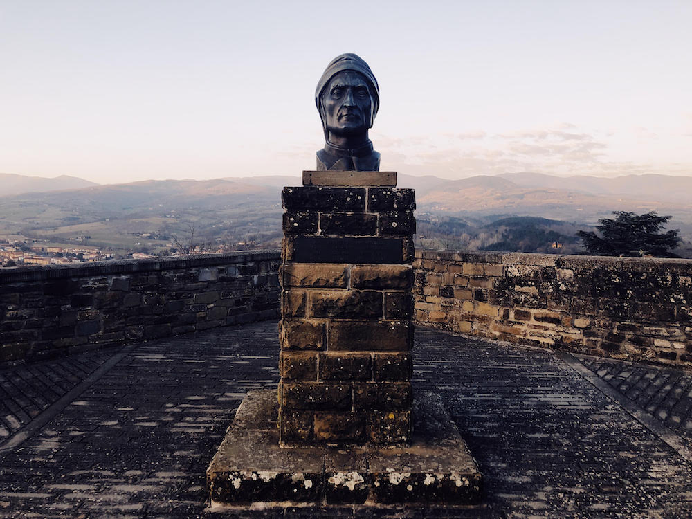 Bust of Dante with hills of Tuscany in the background