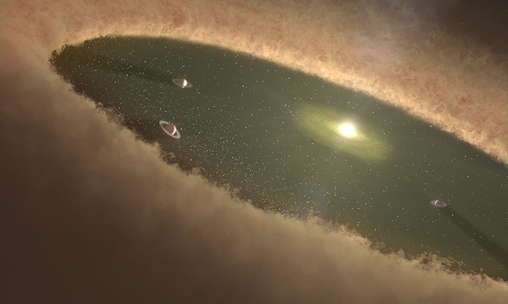 Artist's conception: Planets sweep away a clearing in mass of dust surrounding a fledgling star.
