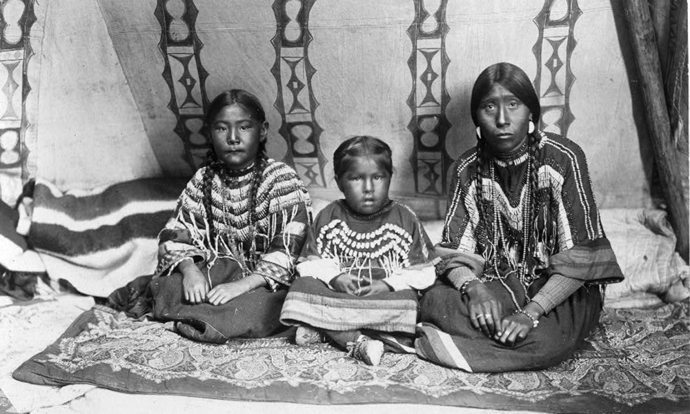 historical photo of a Native woman with two children