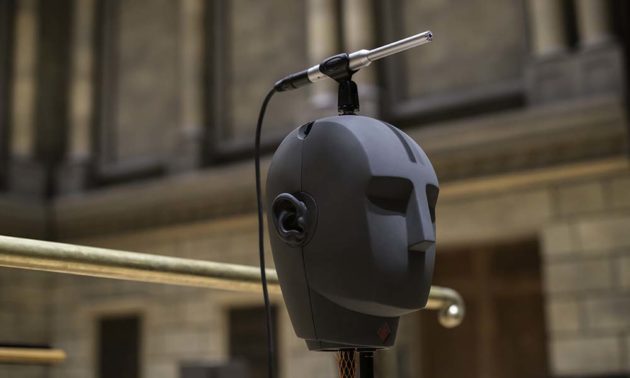 Close up of model of human head poised on a stand on Kodak Hall stage.