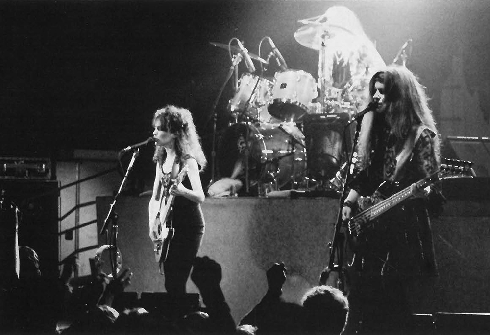 archival photo of the Bangles, on stage in concert.