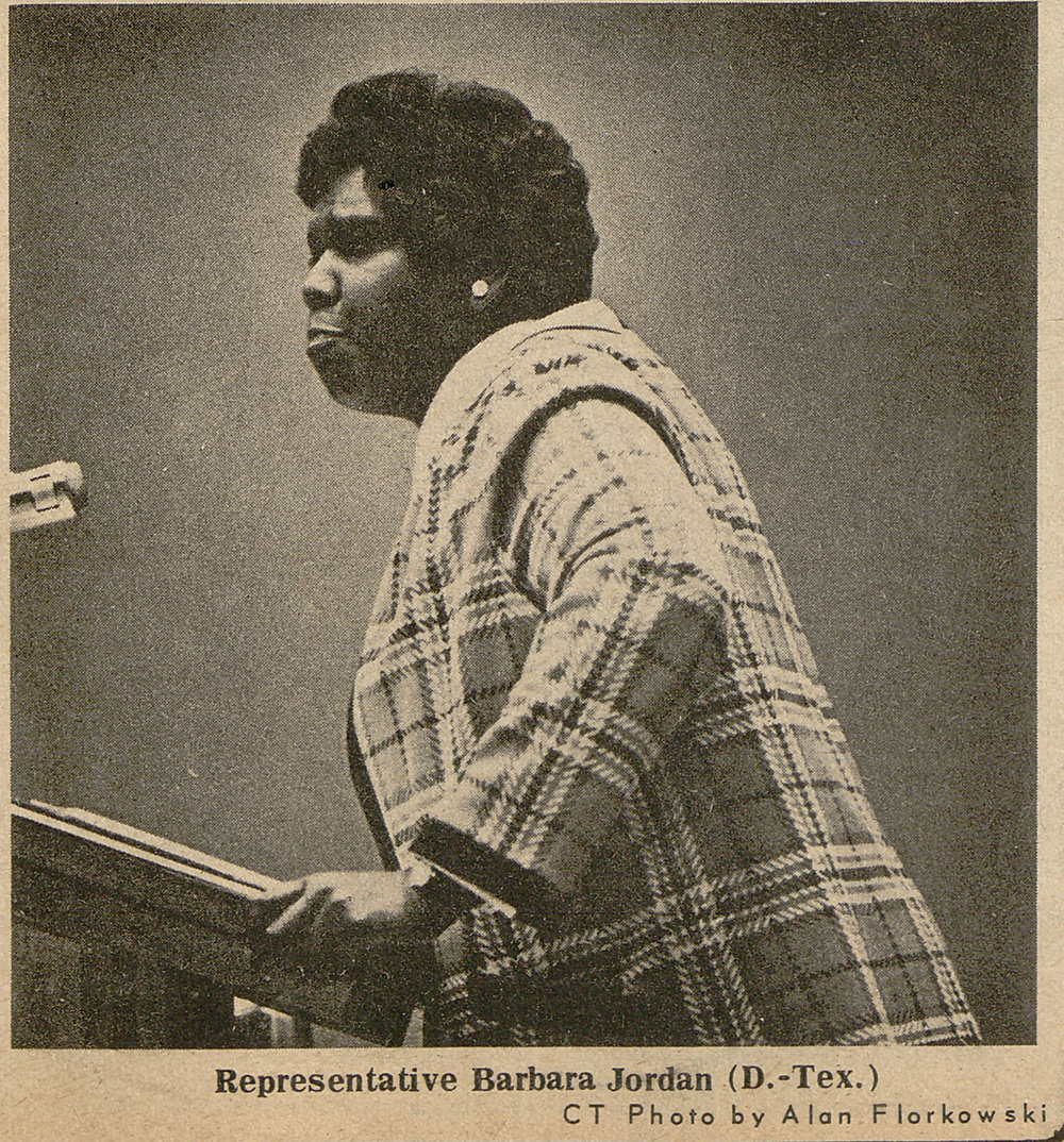 newspaper clipping of a photo of Barbara Jordan speaking from behind the podium.