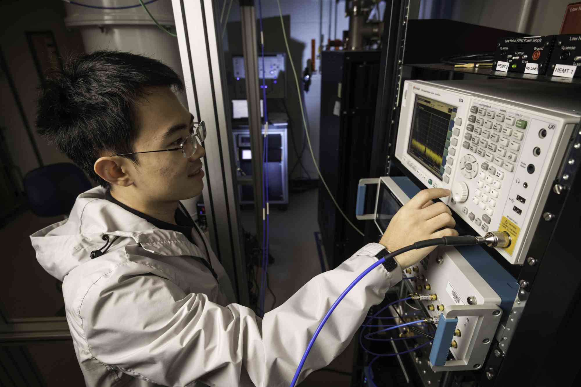 Graduate student working on a microwave control