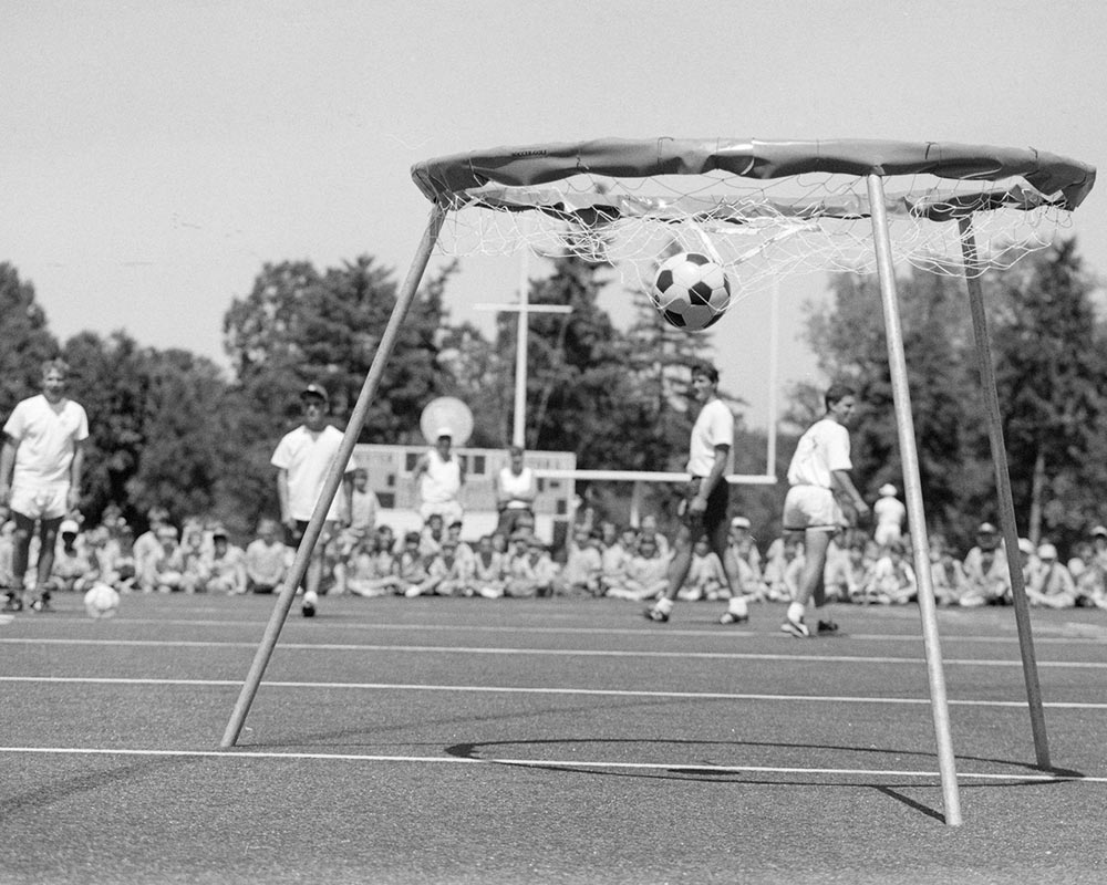 photo of University of Rochester students teaching in a summer sports camp from 1990
