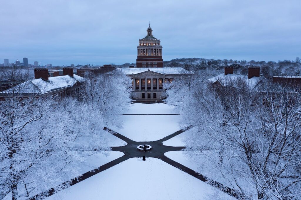 A snowy picture of the quad in front of the Rush Rhees Library at the University of Rochester