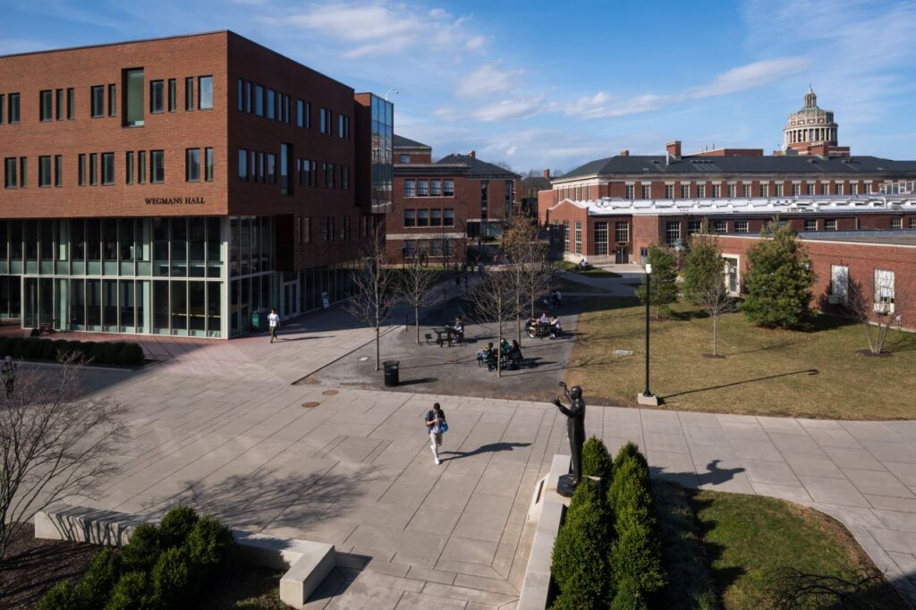 Students walking between classes on the University of Rochester's Hajim Quad