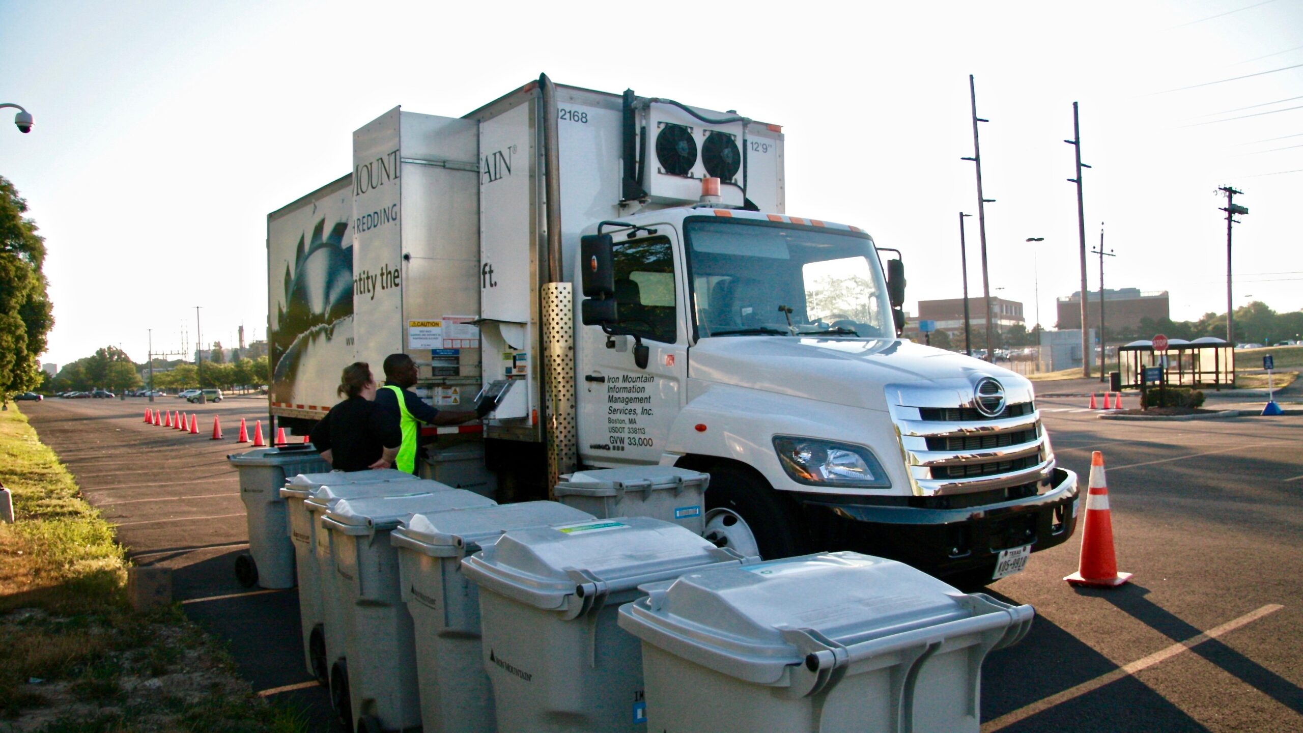 A truck loading documents to be confidentially shredded onto it