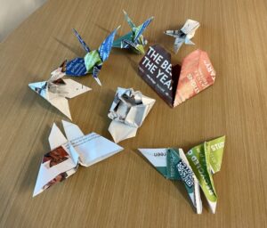 Folded origami art out of recycled packaging and papers