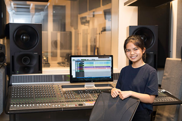 student working in recording studio