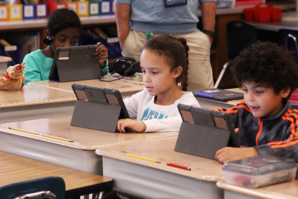 students using ipads in classroom